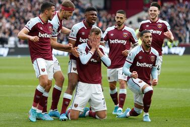 Soccer Football - Premier League - West Ham United v Aston Villa - London Stadium, London, Britain - March 13, 2022 West Ham United's Andriy Yarmolenko celebrates scoring their first goal with teammates Action Images via Reuters/Ed Sykes EDITORIAL USE ONLY.  No use with unauthorized audio, video, data, fixture lists, club/league logos or 'live' services.  Online in-match use limited to 75 images, no video emulation.  No use in betting, games or single club /league/player publications.   Please contact your account representative for further details. 