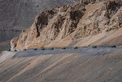 Indian army vehicles move in a convoy in the cold desert region of Ladakh last September. Chinese and Indian military commanders have pledged to 'maintain the peace and tranquility' along their disputed border after a fatal clash in 2020. AP Photo