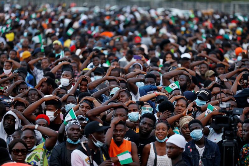 Demonstrators gesture during a protest over alleged police brutality in Lagos, Nigeria on October 17, 2020. Reuters