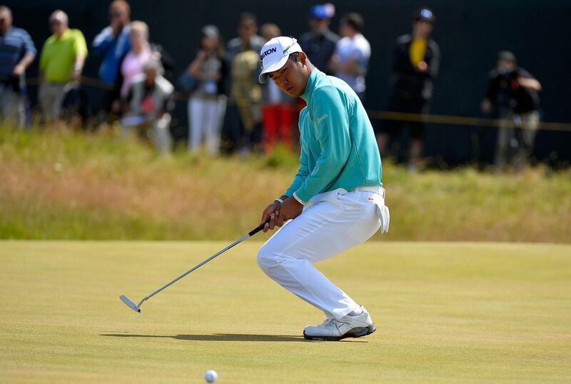 Hideki Matsuyama of Japan reacts after missing his birdie putt on the first green during the final round of the British Open golf championship at Muirfield in Scotland July 21, 2013.   REUTERS/Toby Melville (BRITAIN  - Tags: SPORT GOLF)   *** Local Caption ***  LON703_GOLF-OPEN-_0721_11.JPG
