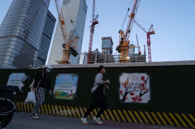 Construction cranes near the central business district in Beijing. The world’s second-biggest economy is struggling to find a firm footing due to a prolonged real estate crisis and persistent doubts over growth. AP