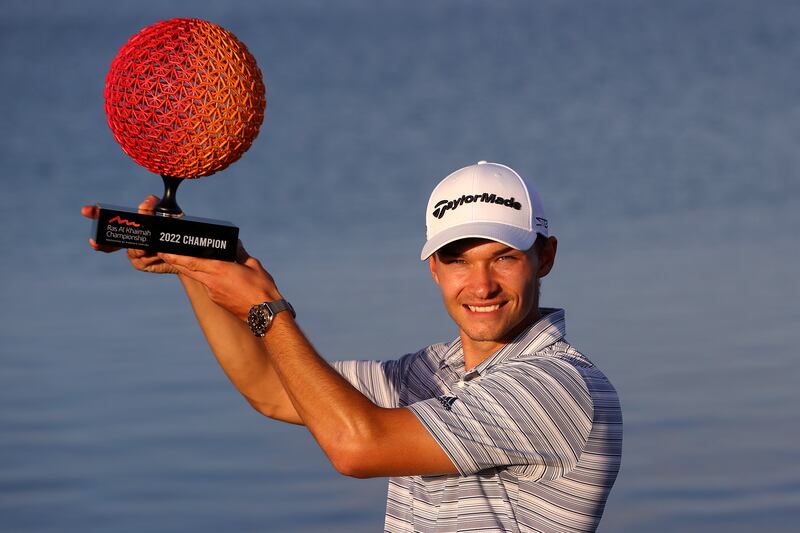 Nicolai Hojgaard of Denmark celebrates with the trophy after winning the Ras Al Khaimah Championship presented by Phoenix Capital at Al Hamra Golf Club on February 6, 2022. Getty