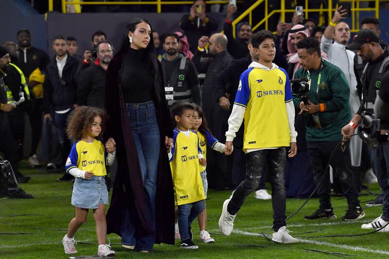 Since moving to Saudi Arabia, Georgina Rodriguez has added the abaya to her wardrobe, wearing one with her children at Mrsool Park on January 3. EPA 