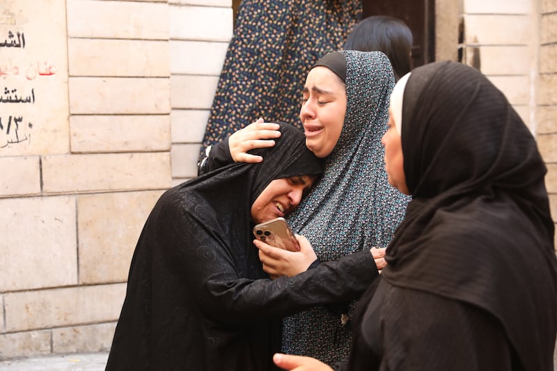 Palestinians grieve for those killed during the raid. EPA