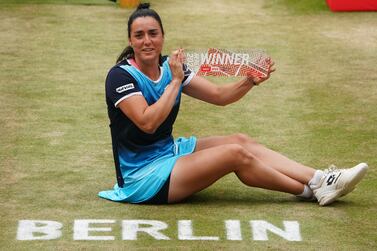 Ons Jabeur of Tunisia poses with her trophy after the final match against Belinda Bencic of Switzerland at the WTA German Open tennis tournament in Berlin, Germany, 19 June 2022.   EPA / CLEMENS BILAN