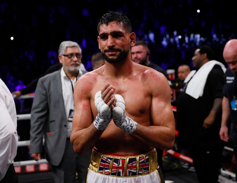 Boxing - Amir Khan v Kell Brook - AO Arena, Manchester, Britain - February 19, 2022 Amit Khan looks dejected after losing the fight Action Images via Reuters / Andrew Couldridge