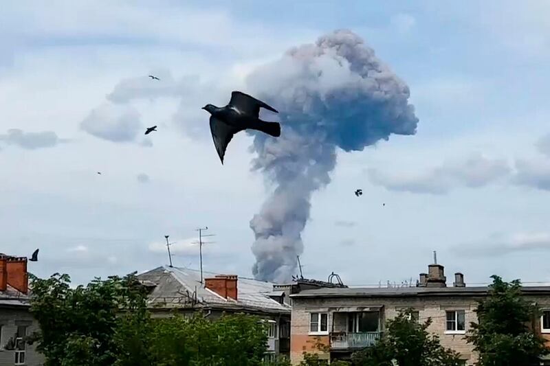 Smoke rises after an explosion in a plant manufacturing TNT explosive in Dzerzhinsk, 400 kilometers (250 miles) east of Moscow, Russia, Saturday, June 1, 2019.  An investigation is underway but the cause of the blast has not been determined and Russia's health ministry says 79 people have been injured in an explosion in a plant manufacturing TNT. (Alina Yegorova via AP)