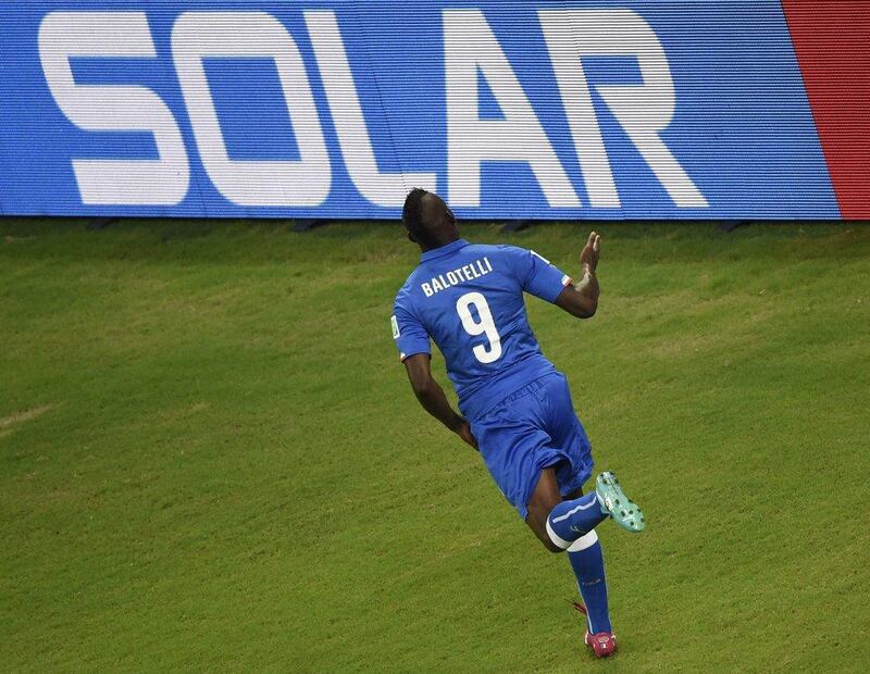 Mario Balotelli celebrates his winning goal against England for Italy in their Group D match at the 2014 World Cup on Saturday. Odd Andersen / AFP