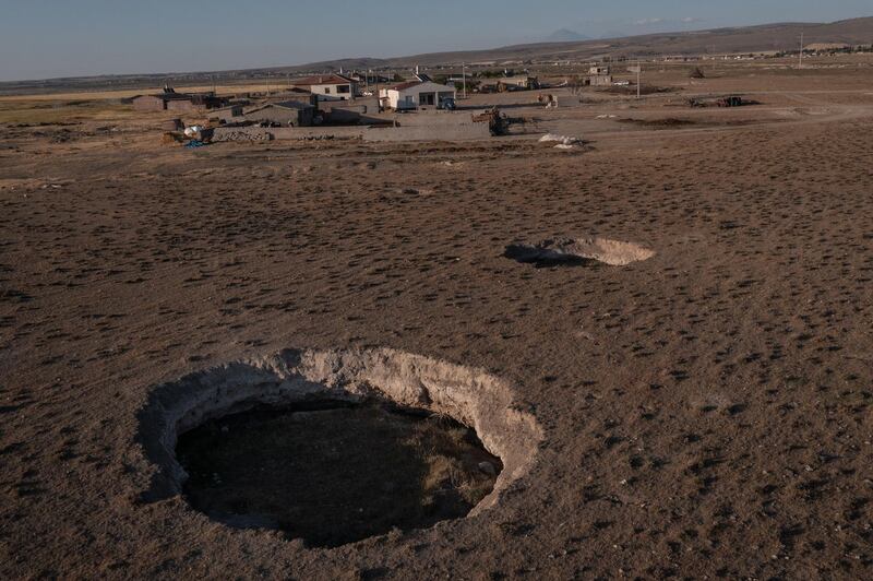 Sinkholes dot the arid Karapinar landscape.