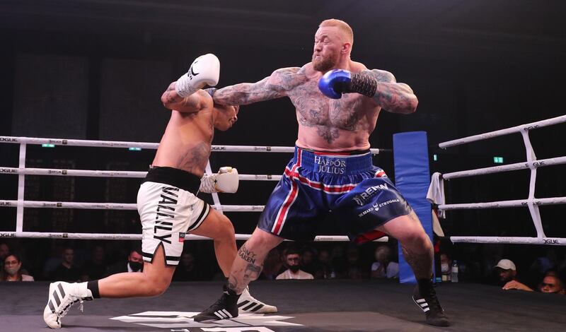 Hafthor Bjornsson, right, of Iceland in action against former Commonwealth Games gold medallist Simon Vallily of England during an exhibition boxing match at the Conrad Dubai Hotel, Dubai. EPA