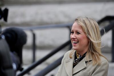 Sky TV political reporter Sophy Ridge, waits to interview the Chief Secretary to the Treasury Danny Alexander, after he appeared on the steps of the Treasury office in London, holding his yellow budget box, after he presented an alternative set of fiscal plans in the House of Commons.