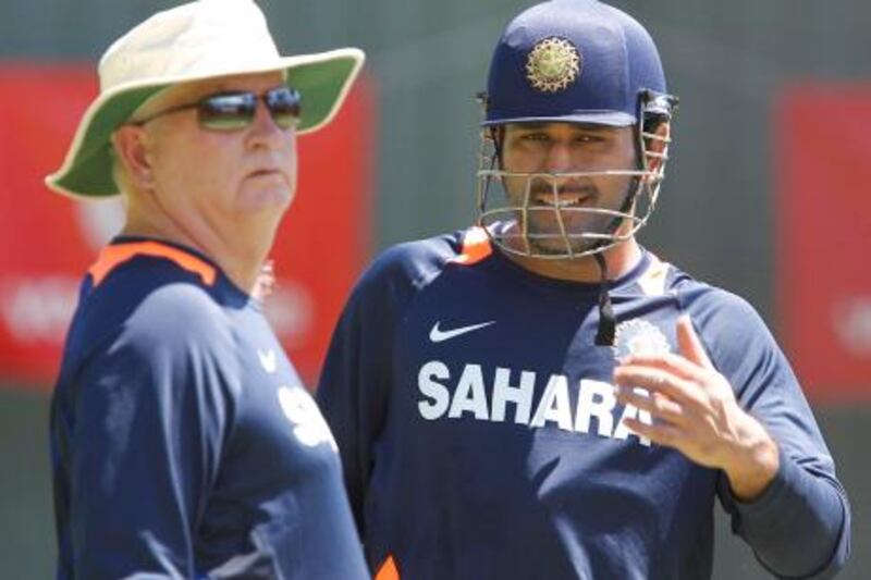 India's Mahendra Dhoni, right, talks to India's coach Duncan Fletcher during a training session at the WACA in Perth, Australia on Wednesday, Jan. 11, 2012. Australia will play India in the third test starting Jan. 13, 2011. (AP Photo/Theron Kirkman) *** Local Caption ***  Australia India Cricket.JPEG-0c526.jpg