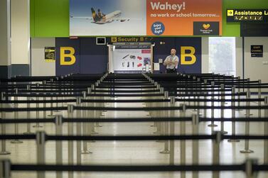 Empty lines ahead of a security gate at Manchester Airport in the UK. Getty