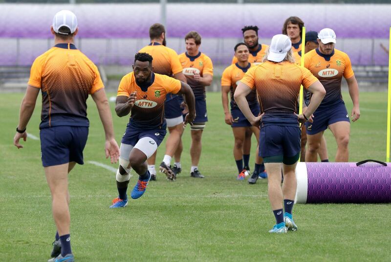 South Africa's captain Siya Kolisi runs during a training session in Tokyo, Japan, Thursday, Oct. 17, 2019. South Africa play Japan in a Rugby World Cup quarterfinal on Sunday Oct. 20. (AP Photo/Mark Baker)