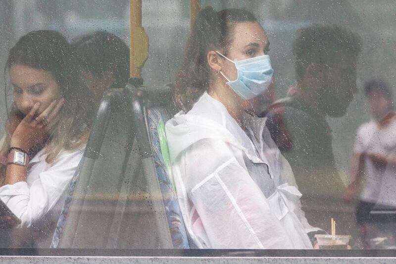 Passengers look on from a bus in Bondi Junction in Sydney, Australia. Sydney's northern beaches is on lockdown, as a cluster of Covid-19 cases continues to grow causing other Australian states and territories to impose restrictions on travel ahead of the Christmas holidays.  Getty Images