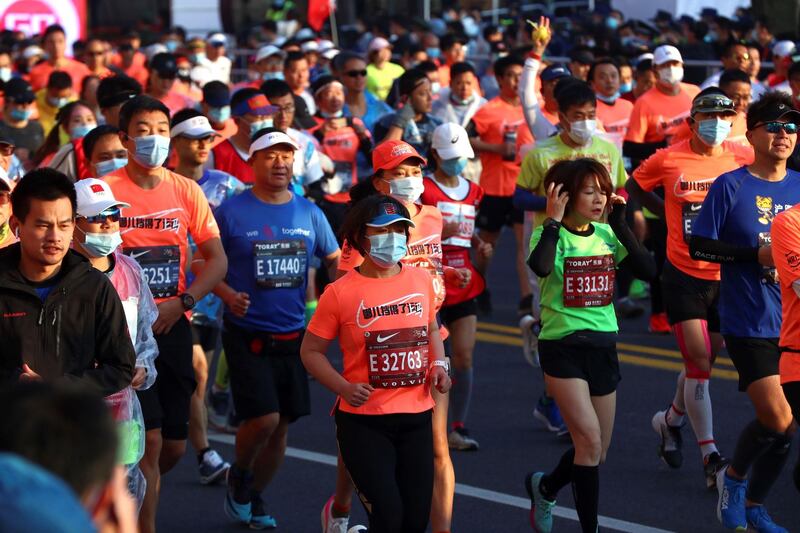 Runners take part in the 2020 Shanghai marathon. AFP