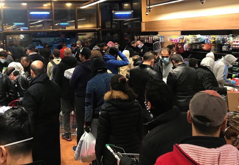 Shoppers fill a local supermarket shortly after the announcement of a curfew in Amman, Jordan.  EPA