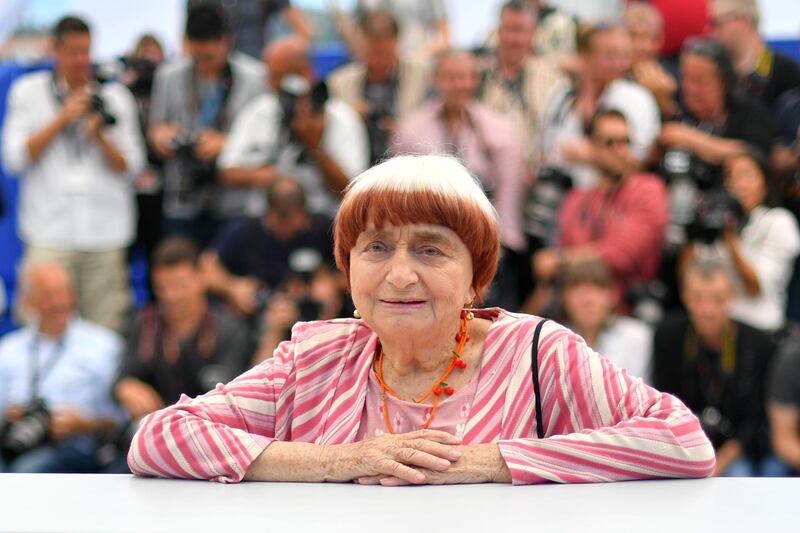(FILES) In this file photo taken on May 19, 2017 French director Agnes Varda poses during a photo call for the film 'Faces, Places' (Visages, Villages) at the 70th edition of the Cannes Film Festival in Cannes, southern France.  French film director Agnes Varda, who emerged in the New Wave of intimate cinema of the 1960s and continued with artful documentaries and films mixing real-life events with fiction, has died aged 90, her family said on March 29, 2019. / AFP / LOIC VENANCE
