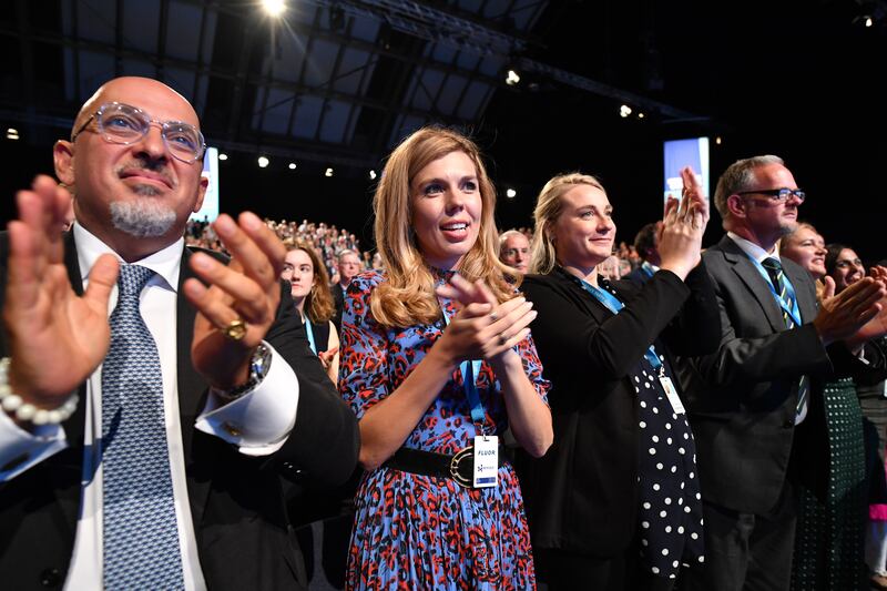 Mr Zahawi stands next to Carrie Symonds at the 2019 Conservative Party conference in Manchester. Getty Images