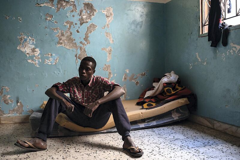 Mustapha, 17-years-old from Darfur, has been in Libya for two years. Mustapha is one of the survivors of the Tajoura detention centre bombing from July 2019, which killed 53 people and injured an estimated 130 others. Mustapha says he spent two months in prison because he was without documents.  He says he is registered with UNHCR to be relocated to a safe area, but like many others in his situation, he hasn't received any answer. Now he lives in a shared room with other refugees in Tripoli and doesn't have any income apart from his work cleaning out the rooms of the building where he lives, which he exchanges for the cost of staying at the shelter. He says the building is managed by a local Libyan - the price of the shelter for the other refugees is 5 Libyan Dinars per day. He says he would like to would reach Europe to get treatment for his right hand which was wounded from a gunshot by a militiaman in his home country of Sudan, which is ravaged by war.