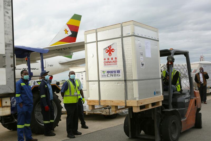 A forklift moves part of the Sinopharm Covid-19 vaccine from China upon arrival at Robert Mugabe International airport in Harare, Zimbabwe. AP Photo