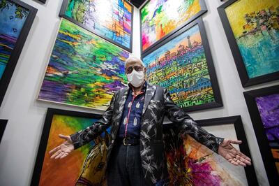 Dubai, United Arab Emirates - Artist Anjini Prakash Laitu with his artworks at the World Art Dubai at Dubai World Trade Centre.  Leslie Pableo for The National for Razmig's story