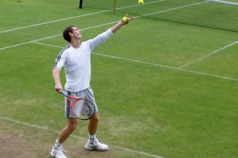 Great Britain’s Andy Murray lofts up a serve during a practice session at Wimbledon on Sunday. Mike Hewitt / Getty Images