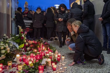 People gather in front of the Arena Bar to commemorate the victims of the shooting. Thomas Lohnes/Getty Images