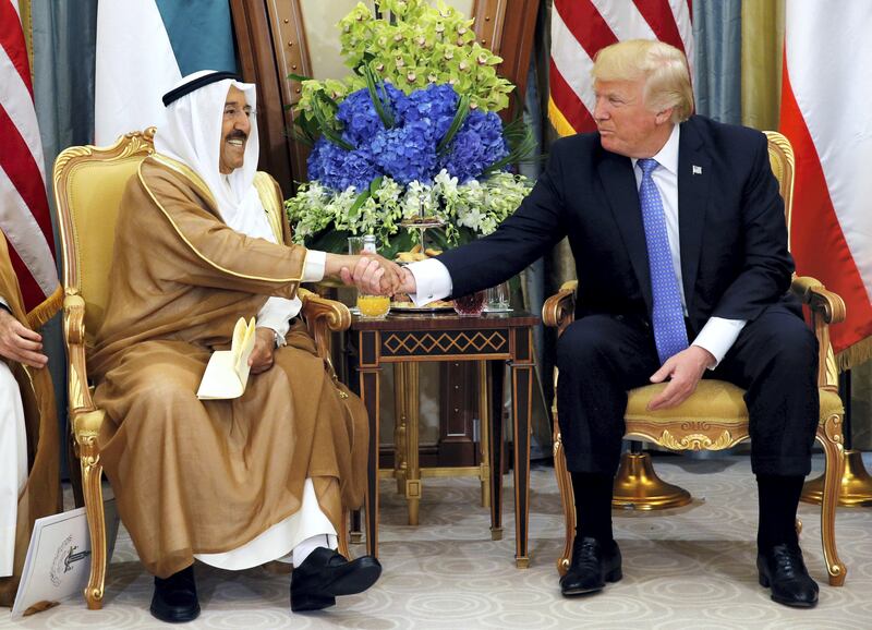Emir of Kuwait Sabah Al-Ahmad Al-Jaber Al-Sabah shakes hands with U.S. President Donald Trump during their meeting in Riyadh, Saudi Arabia, May 21, 2017. REUTERS/Jonathan Ernst - RC14170A4C00