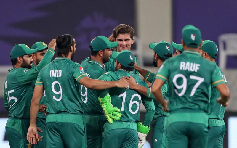 Pakistan players celebrate with Shaheen Afridi after the dismissal of India's KL Rahul during the 2021 T20 World Cup in Dubai. AP