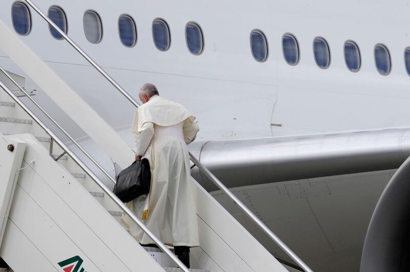 Pope Francis boards the airplane at Rome's Fiumicino International airport. AP Photo