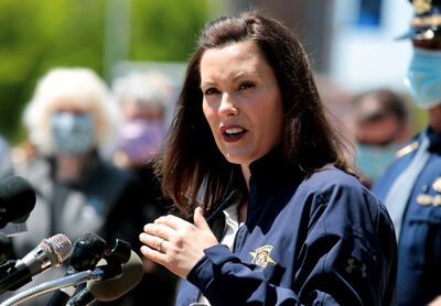 FILE PHOTO: Michigan Governor Gretchen Whitmer addresses the media about the flooding along the Tittabawassee River, after several dams breached, in downtown Midland, Michigan, U.S., May 20, 2020. REUTERS/Rebecca Cook/File Photo