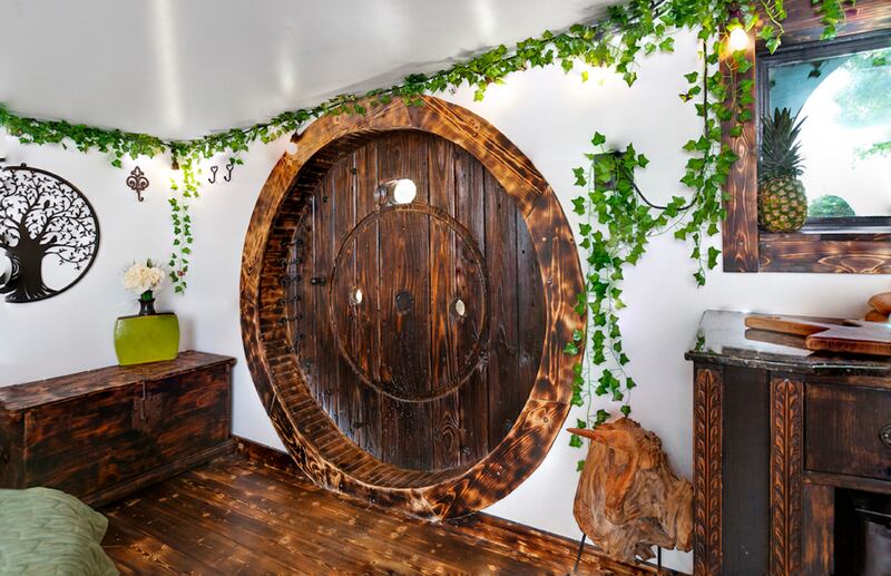 The circular door of this real-life hobbit house in Texas reflects Bag End, the home of Bilbo Baggins. Photo: Dasha Wright