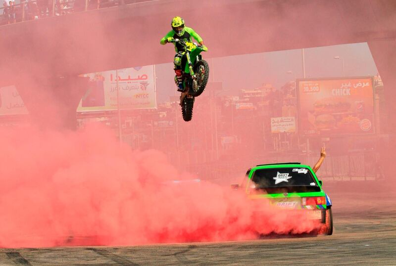 A motocross rider performs a jump at the Saida Automotive Festival in the Lebanese southern port city of Sidon. AFP