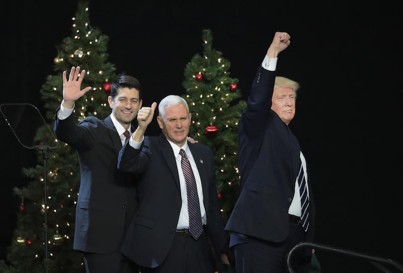 WEST ALLIS, WI - DECEMBER 13: Paul Ryan (L), speaker of the U.S. House of Representatives, Vice President-Elect Mike Pence (C), and President-Elect Donald Trump leave the stage after speaking to supporters at a Thank You Tour 2016 rally on December 13, 2016 in West Allis, Wisconsin. Trump and Pence have been holding the rallies in several states recently to thank voters for electing them.   Scott Olson/Getty Images/AFP