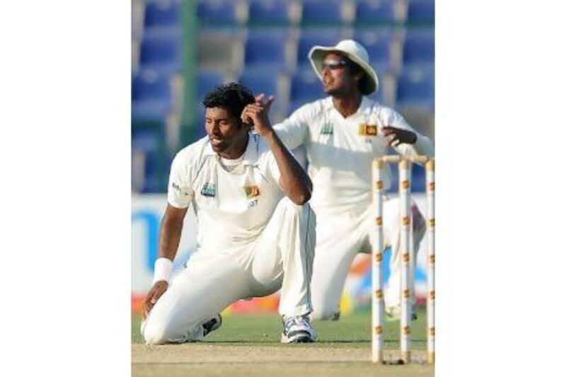 Chanaka Welegedara and the other bowlers laboured throughout the second day without much success. Lakruwan Wanniarachchi / AFP