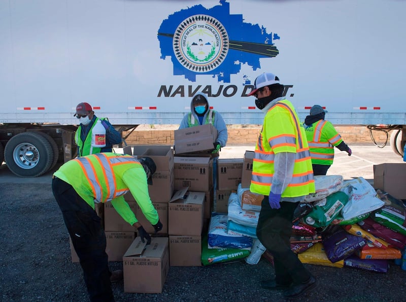 Volunteers from the Navajo Nation prepare care boxes at the town of Casamero Lake in New Mexico. The Navajo Nation now has the highest Covid-19 infection rate in the US after surpassing New York. AFP