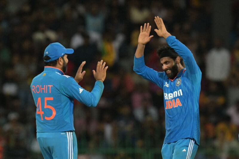 India's Ravindra Jadeja, right, celebrates with Rohit Sharma after taking the wicket of Sri Lanka's Dhananjaya de Silva. AFP
