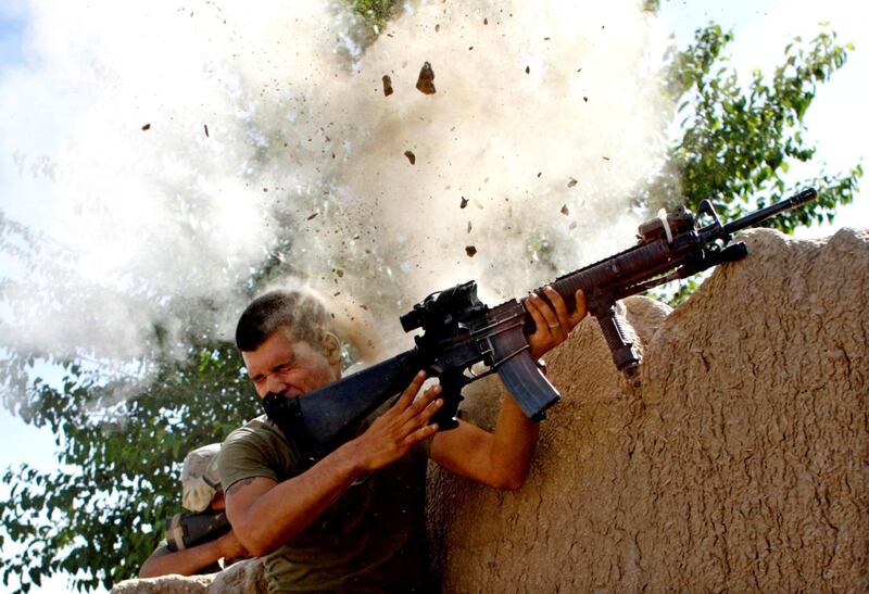 Sgt William Olas Bee, a US Marine from the 24th Marine Expeditionary Unit, has a close call after Taliban fighters opened fire near Garmsir in Helmand Province of Afghanistan, May 18, 2008. Reuters