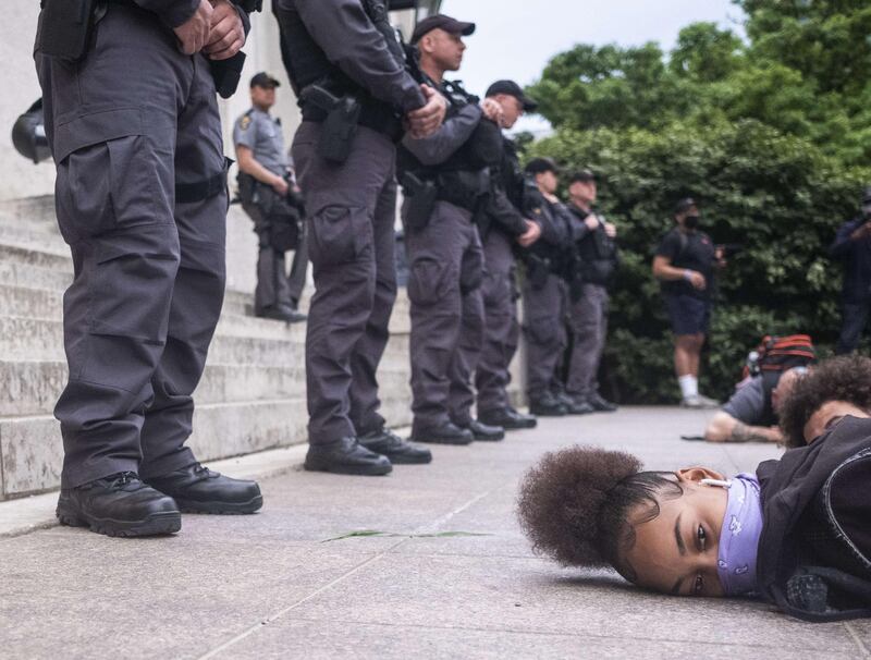 Protesters perform a mass 'die-in' in front of the Ohio Statehouse at the exact time George Floyd died on May 25 in Minneapolis police custody in Columbus, Ohio. Getty