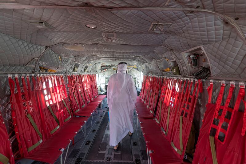 A visitor looks at a Chinook helicopter on the second day of the Dubai Airshow 2021. All photos: Chris Whiteoak/ The National