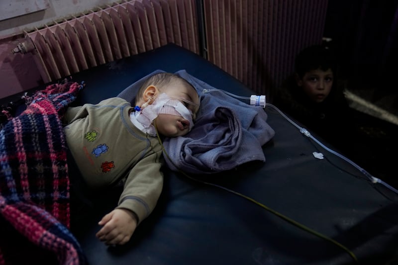 A child, injured in the earthquake, is treated at the hospital in Bab al-Hawah, Syria, on the border crossing with Turkey, Sunday, Feb.  12, 2023.  Six days after a massive earthquake killed thousands in Syria and Turkey, sorrow and disbelief are turning to anger and tension over a sense that there has been an ineffective, unfair and disproportionate response to the historic disaster.  (AP Photo / Hussein Malla)