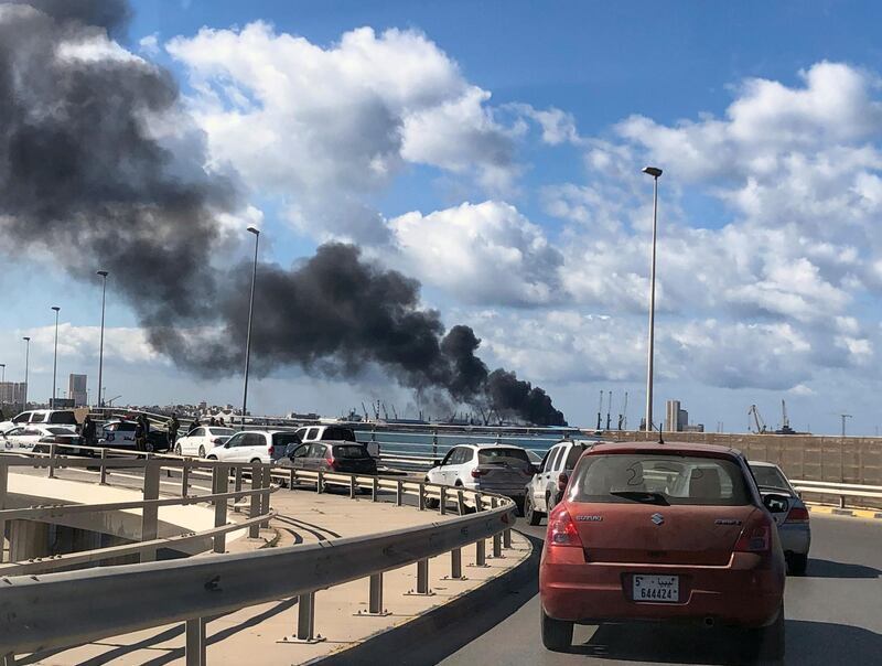 Smoke rises from a port of Tripoli, Libya after being attacked. REUTERS