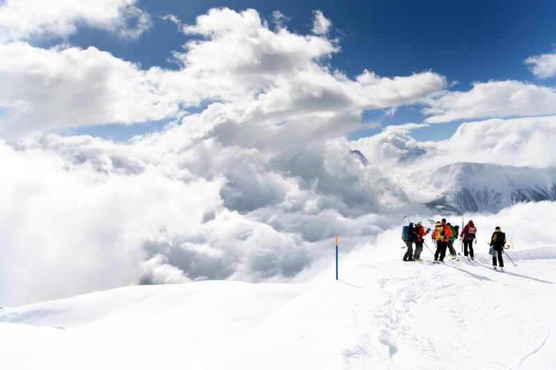 Rescue crews walk in the direction of an avalanche site to search for five missing hikers in Obers Taelli over the Fiescheralp, in Switzerland. Jean-Christophe Bott / EPA