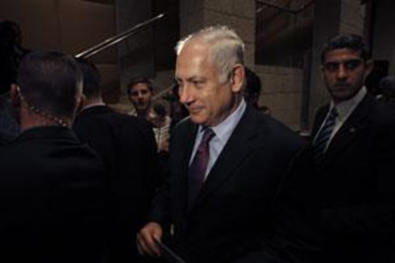 Benjamin Netanyahu leaves after speaking at a conference in Jerusalem today.