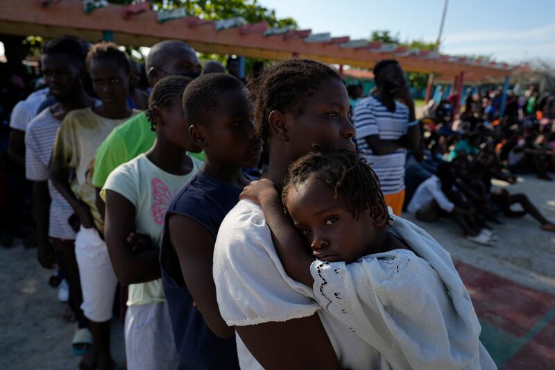 Haitians who arrived in Cuba while trying to sail to the US queue for health care and to be registered at a tourist campsite in Sierra Morena, Villa Clara province. They were on a vessel carrying more than 800 Haitians who were trying to reach the US, Cuban state media said on Wednesday. AP