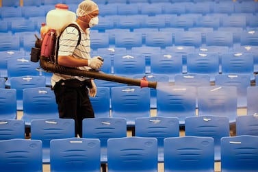  A worker disinfects a auditorium after classes were suspended for sanitation operations in an elementary school in Cainta town of Rizal province, east of Manila. EPA