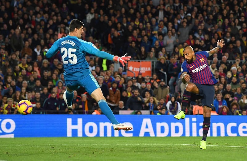 Arturo Vidal of Barcelona scores his sides fifth goal past Thibaut Courtois of Real Madrid during the La Liga match between FC Barcelona and Real Madrid CF at Camp Nou in Barcelona, Spain. Getty Images