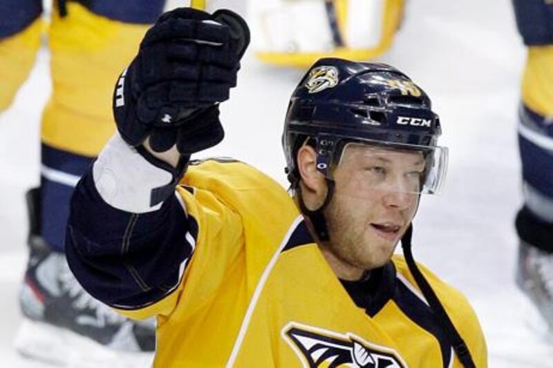 This April 20, 2012 photo shows Nashville Predators right wing Andrei Kostitsyn, of Belarus, celebrating after beating the Detroit Red Wings in Game 5 of a first-round NHL hockey playoff series in Nashville, Tenn. The Nashville Predators have suspended forwards Alexander Radulov and Kostitsyn for Game 3 on Wednesday night against the Phoenix Coyotes for violating team rules.  The Predators announced the suspensions Tuesday morning, May 1, 2012,  and did not specify which rules the forwards broke. (AP Photo/Mark Humphrey)