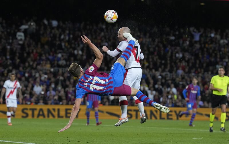 Barcelona forward Luuk de Jong, left, and Isac Palazon battle for the ball. EPA 